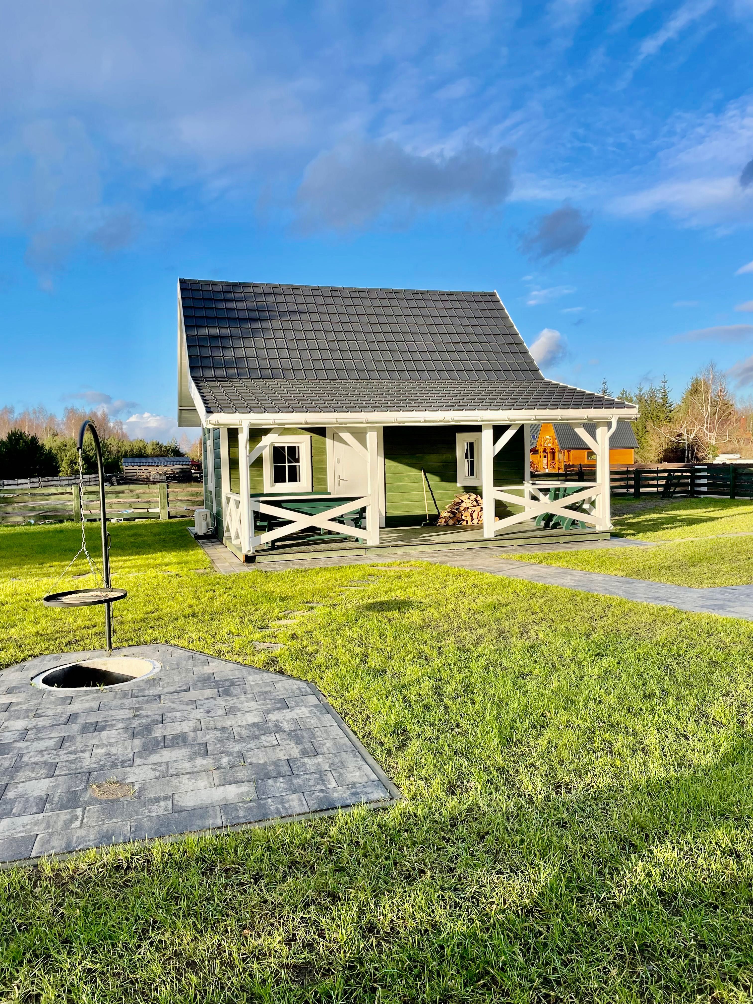 Zielony domek 12 osób basen sauna Pilchy Roś wynajem Mazury