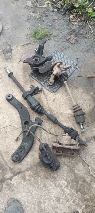 Стойки передние и задние Мазда 323 в сборе