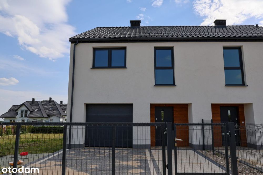 Dom jednorodzinny w zabudowie bliźniaczej z dużą działką w Pęgowie