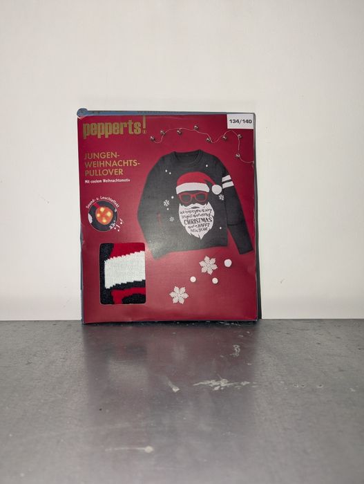 Świąteczny sweter chłopięcy z mikołajem niebieski Pepperts 134/140