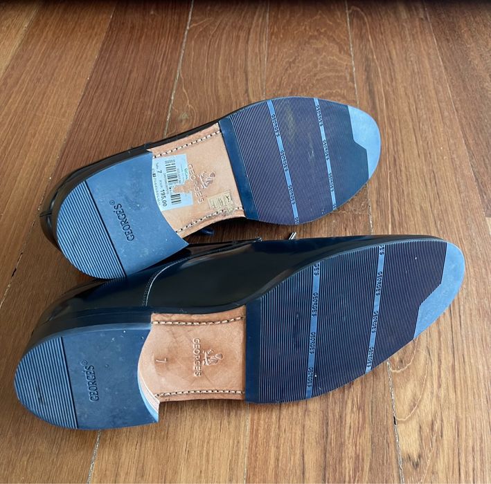 Sapatos elegantes de homem