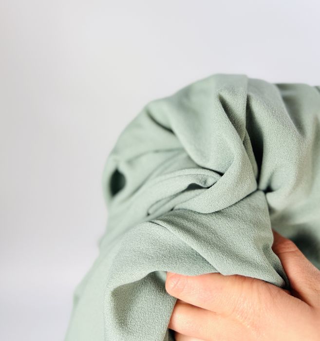 Miętowe spodnie z szeroką nogawką XS 34