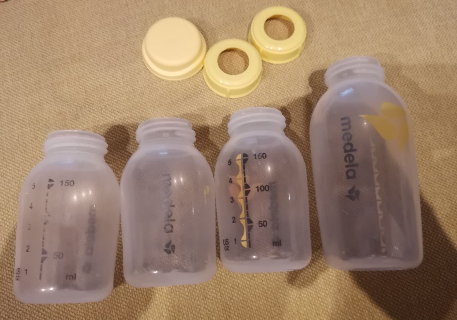 Butelki MEDELA 150ml oraz 250ml plus nakretki do smoczka i zamykająca