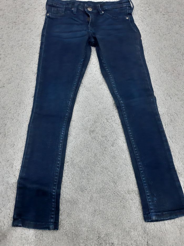 Spodnie dziewczęce firmy Denim w rozmiarze 110cm