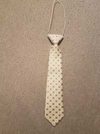 Krawat na gumce dla małego chłopczyka Kolor ecru brązowy
