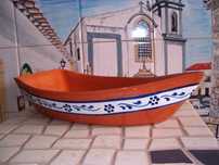Barco em barro para marisco