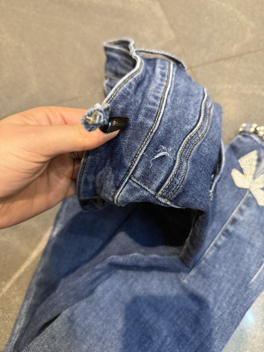 Spodnie jeansowe xs wysoki stan niebieskie kokardki cekiny 34