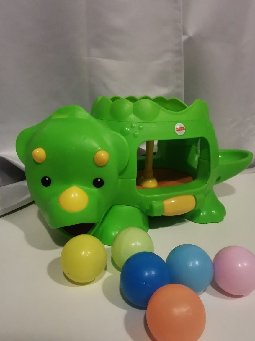 Dinozaur Fisher Price ze skaczącymi piłeczkami