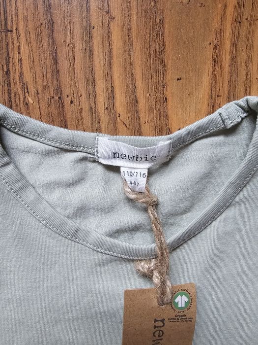 Newbie śliczna bluzeczka z ażurowymi rękawkami. Rozmiar 110/116. Nowa