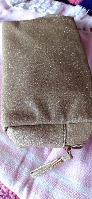 Vendo bolsa dourada marca Oriflame