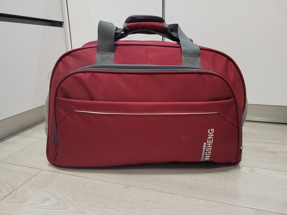 Дорожня сумка TONGSHENG 62x39x25 матеріал нейлон колір бордовий