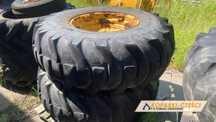 Koła 18,4x26 New Holland LB 95 / 110, Hitachi FB 100, CAT 428 B / C