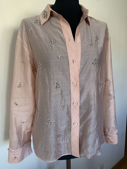 Blusa com aplicacoes  brilhantes