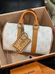 Mochila bandoleira LOUIS VUITTON Keepall 25.
