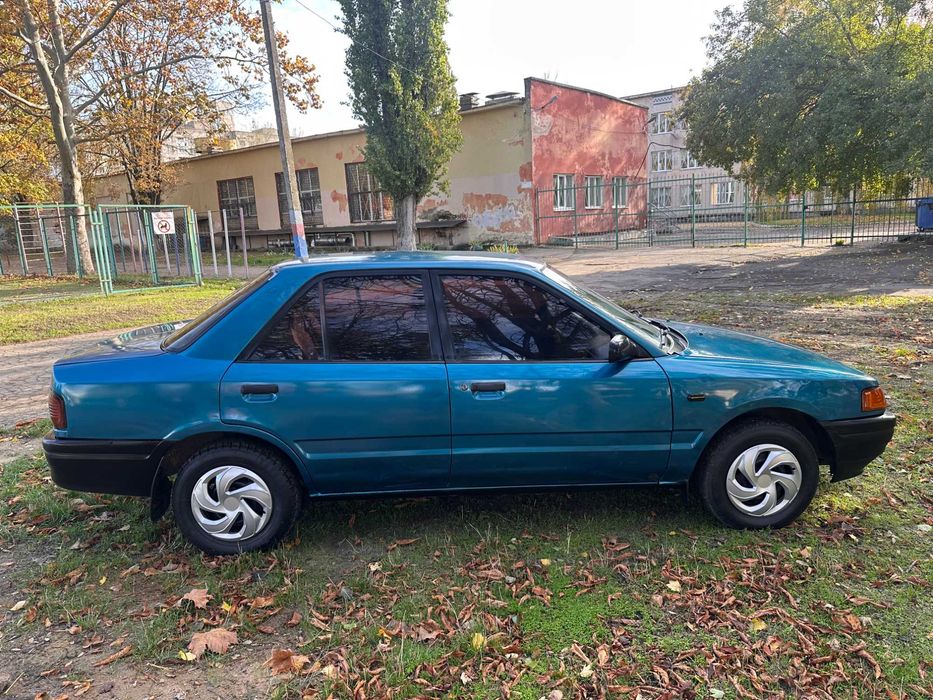 Mazda 323 расход 7л/100км