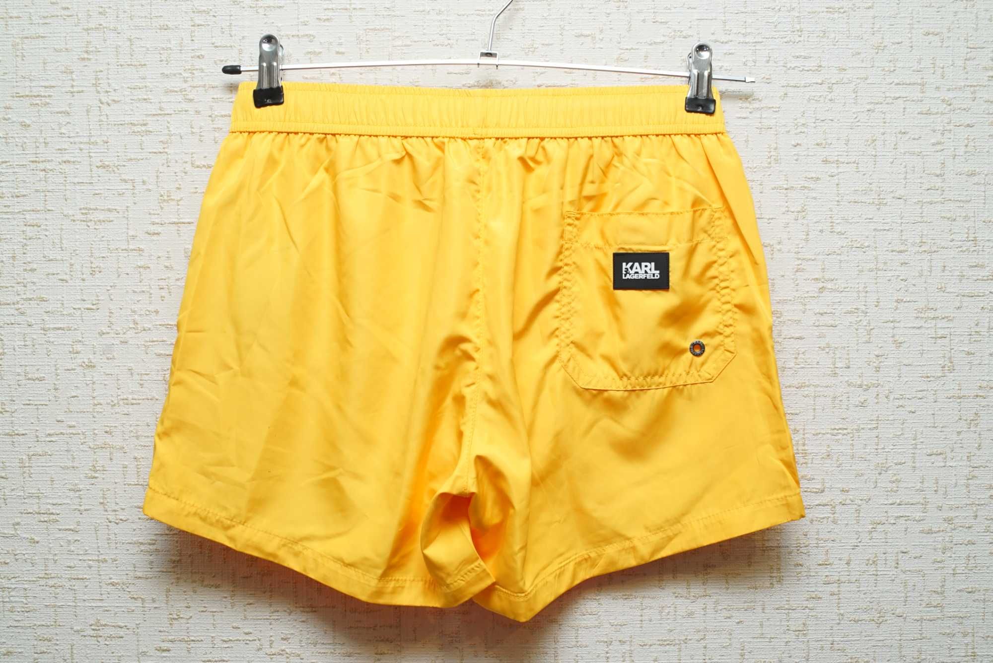 Мужские плавательные шорты KARL LAGERFELD желтого цвета.