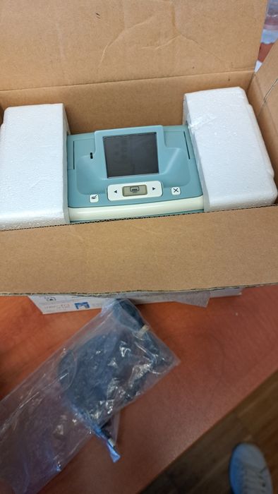 Impressora HP Photosmart A526 com 200 folhas de papel fotográfico.