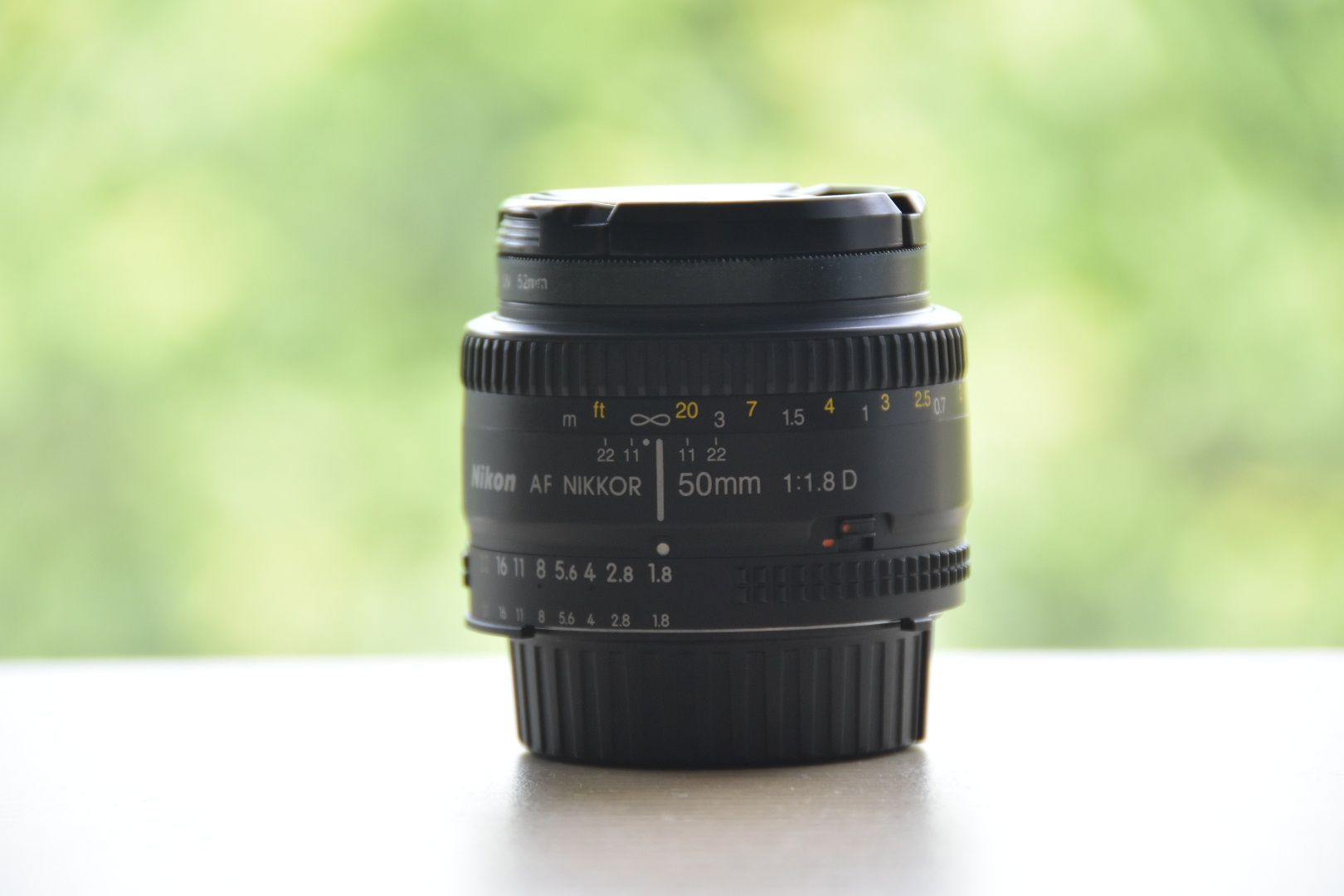 Nikkor 50 1.8 D AF + filtr UV + 2x dekielki + futerał Nikon obiektyw