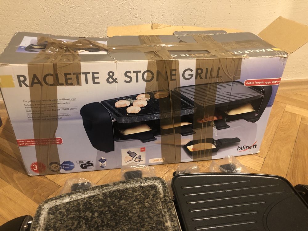 Grill elektryczny „Raclette & Stone”. Duzo pojemników, szybko grzeje.