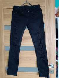 Spodnie jeansowe z dziurami S