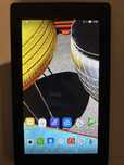 Tablet lenovo ze słuchawkami oraz z pudełkiem