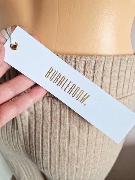 Spodnie materiałowe beżowe rozkloszowane szerokie dzwony prążkowane bu