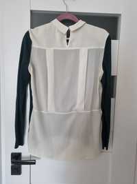Sweter H&M z białą półprzezroczystą bluzką na plecach