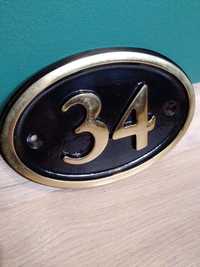 Tabliczka z numerem domowym 34