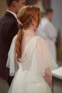 Suknia ślubna ze zwiewnym rękawem