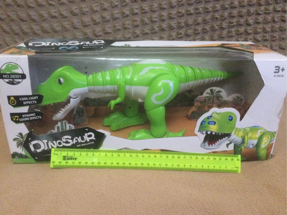 Продам игрушку динозавр .