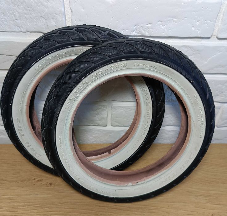 Opona  do wózka, rowerka DELI SA-206 12 1/2 x 2 1/4 biały bok