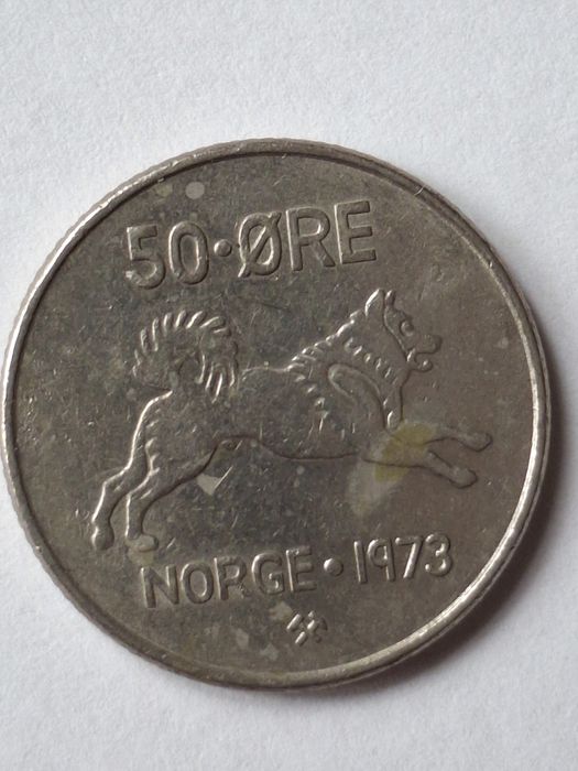 Dziesięć monet z motywami zwierząt.