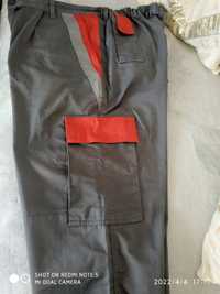 Spodnie robocze szare z czerwonymi wstawkami.