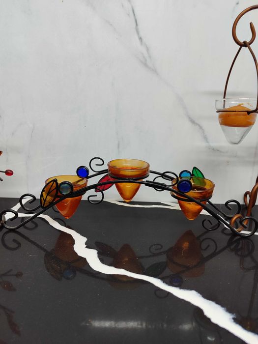 4 castiçais/porta velas