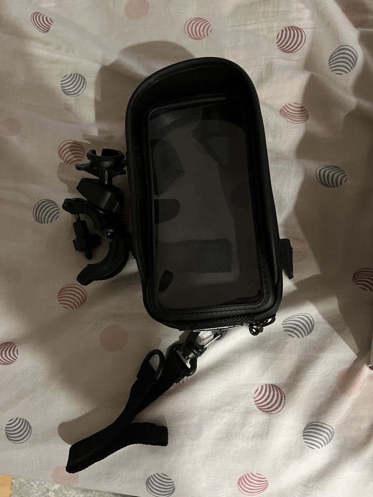 Vendo suporte para telemovel com proteccao da chuva novo