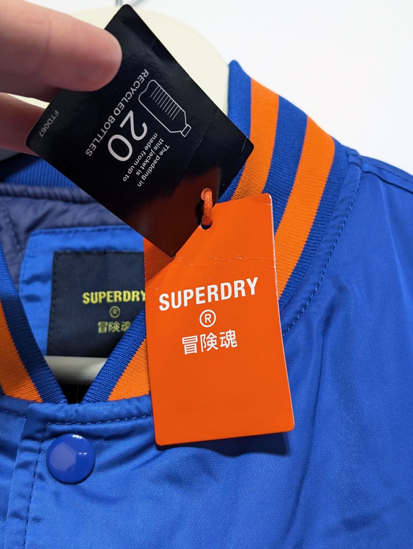 Niebieska ocieplana bomberka varsity Superdry, rozmiar 2XL