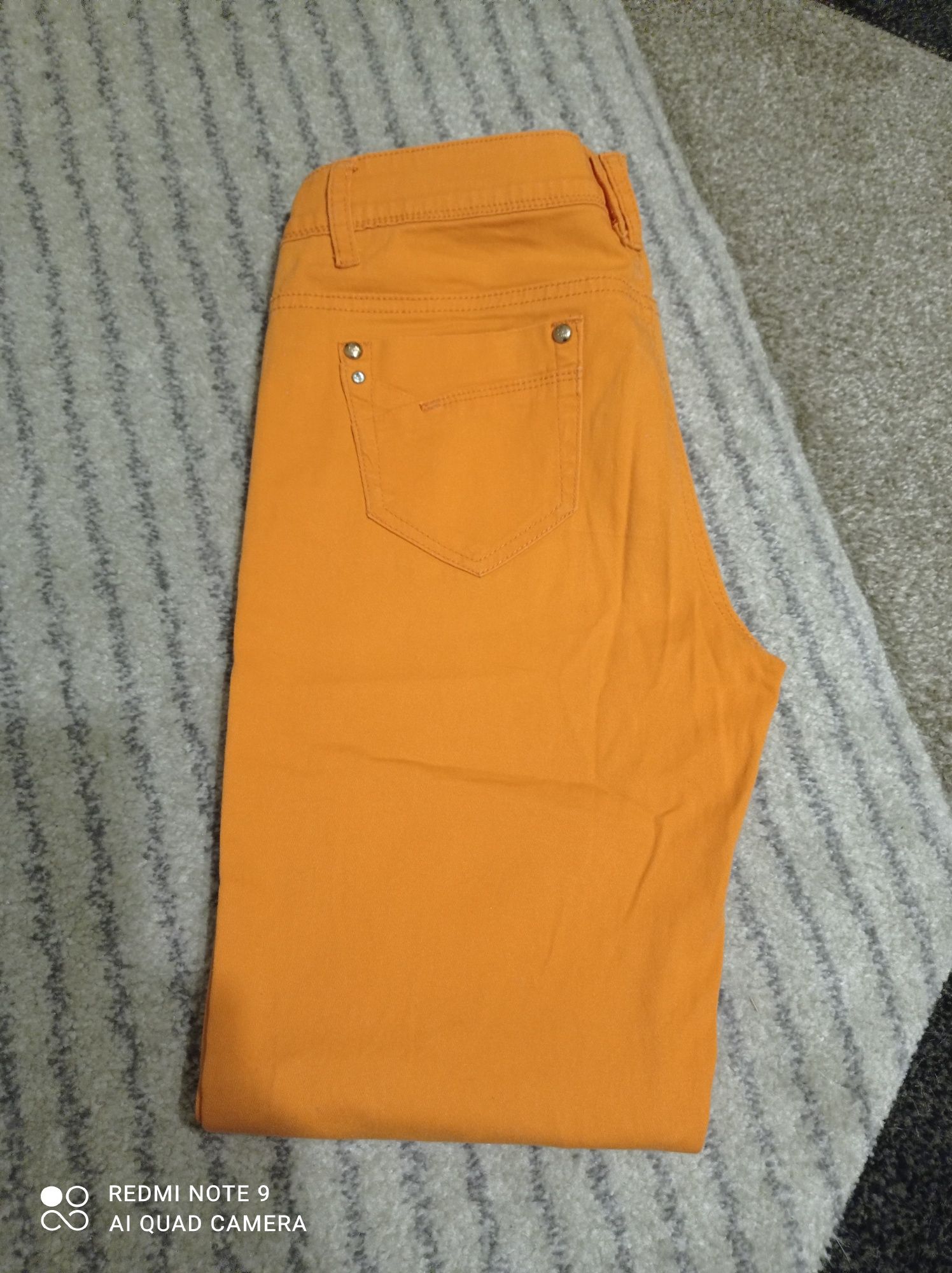 Spodnie jeans damskie S/M pomarańczowe