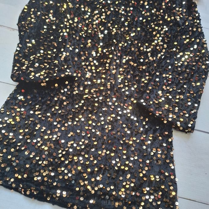 Nowa viralowa sukienka z cekinami i kokardą 134/140