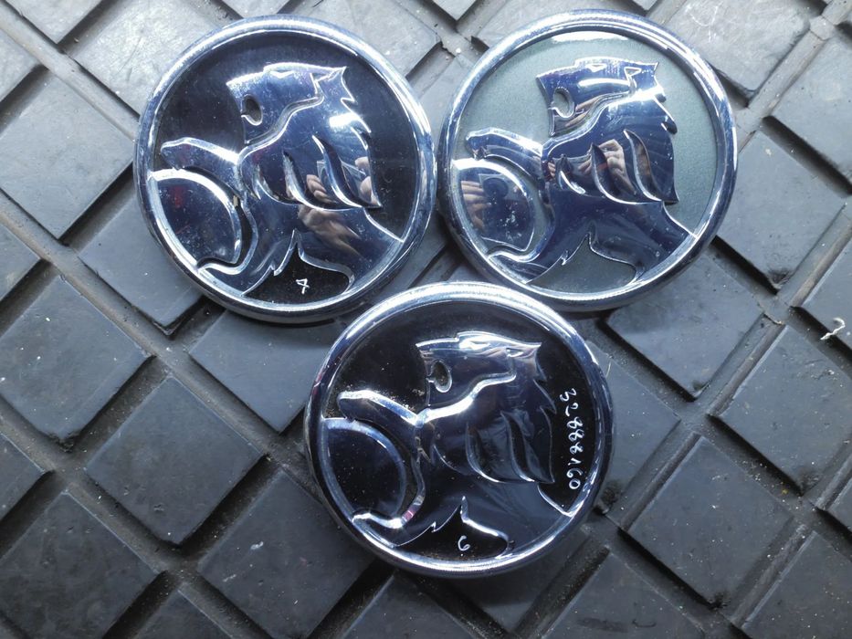 LOGO PRZYCISK KLAPY TYLNEJ OPEL ASTRA J IV HB 39061716