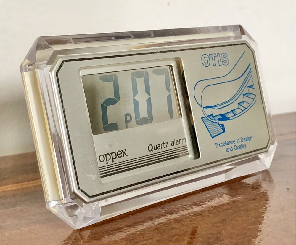 Retro zegarek budzik LCD kwarcowy Oppex reklama OTIS przeźroczysty vtg
