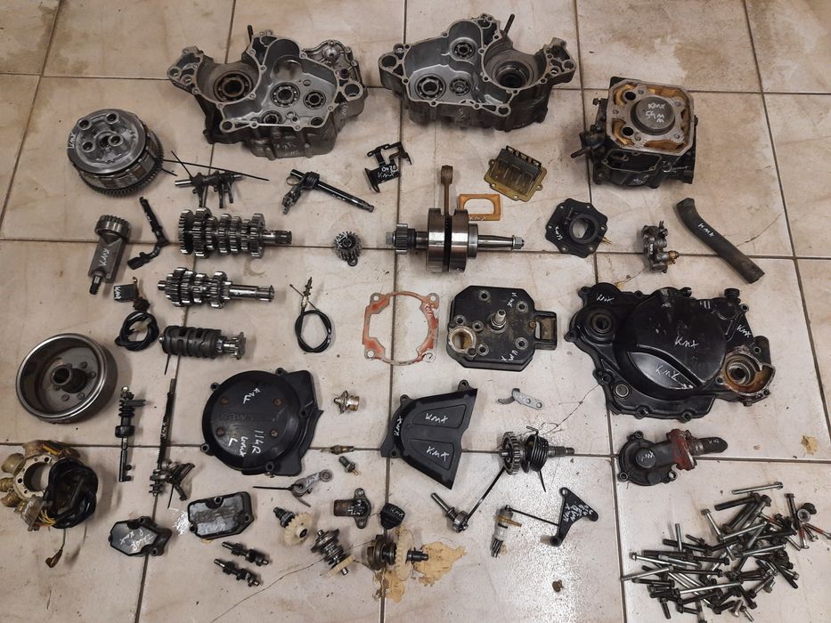 Kawasaki KMX 125 silnik części cylinder wał magneto kapa sprzęgło MXI