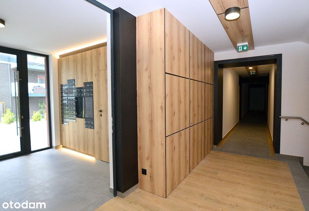 Nowy apartament z tarasem iogródkiem