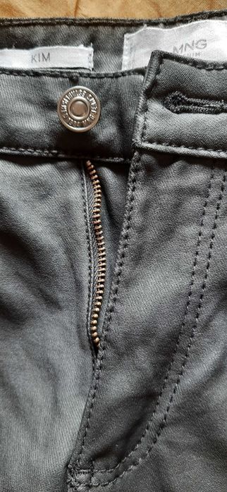 Calças em tecido cerado