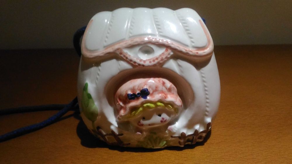 Conjunto de mealheiro e porta retratos em louça. Novo