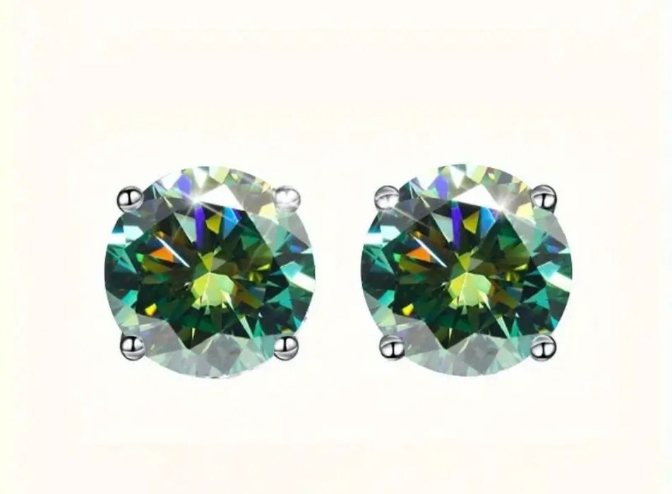 Яскравий муассаніт зеленого кольору , срібні з покриттям платини. Серт