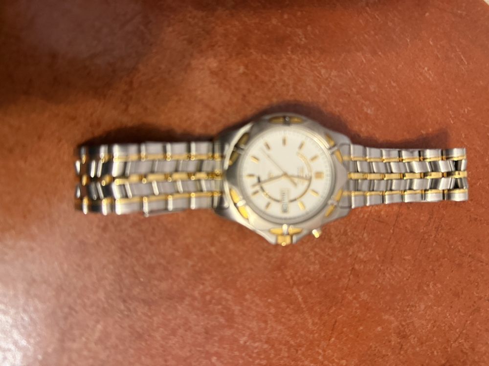 Relogio seiko kinetic , bracele em aco , decorado a dourado . Impecave