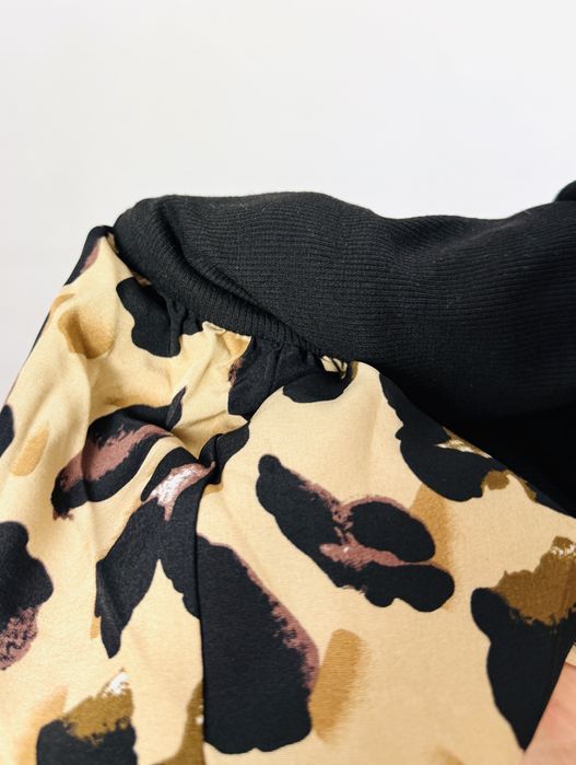 Czarna sukienka z dzianinową górą i rozkloszowanym dołem w panterkę