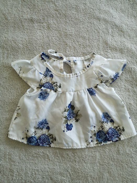 Biała elegancka zwiewna wiązana bluzka w kwiatki 68 - 74 jak nowa