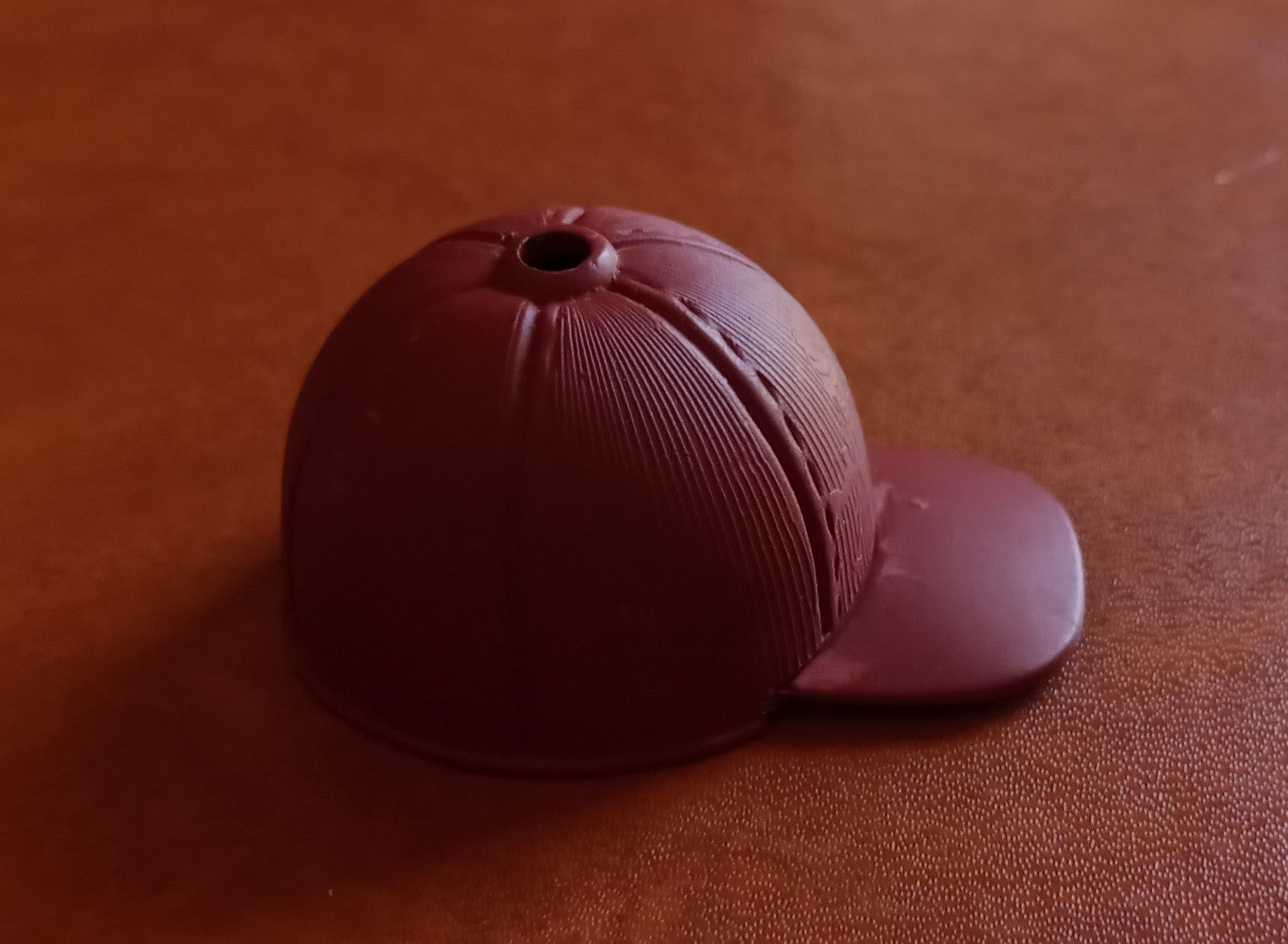 Isqueiro, chapeu, boné