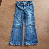 36. Spodnie jeansowe dla  dziewczynki rozmiar 122 firmy H &M